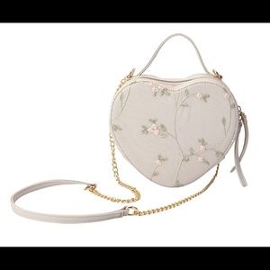 82.) Cream Floral Faux Leather Crossbody Bag